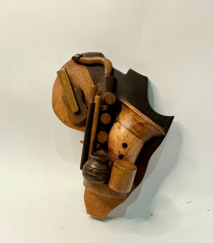 CARVED INSTRUMENTAL WALL HANGING